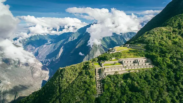 Aerial view of a trekking trail leading to a scenic mountain fortress.