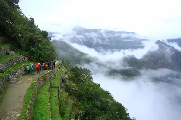 Arrival to Machu Picchu through the Sun Gate after Inca Trail trek