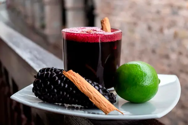 Glass of chicha morada, one of the top traditional Peruvian drinks
