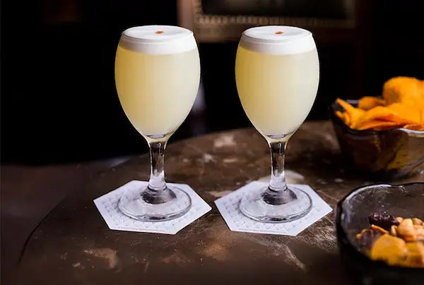 Traditional Pisco Sour cocktail, iconic Peruvian drink