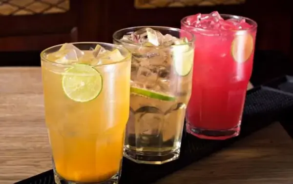 Top traditional Peruvian drinks arranged on a table, part of Peruvian cultural experience
